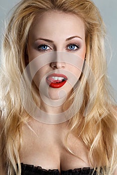 Blonde woman with tongue out