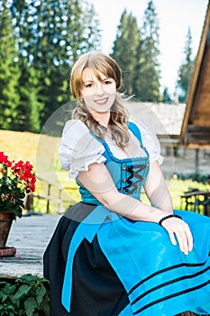 Blonde Woman in traditional austrian clothes