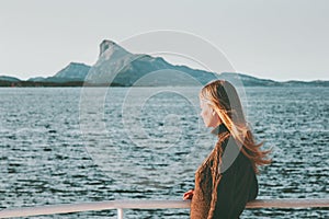 Blonde Woman Traveler on sea ferry in Norway landscape Travel Lifestyle concept adventure