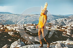 Blonde Woman walking outdoor in mountains hair on wind