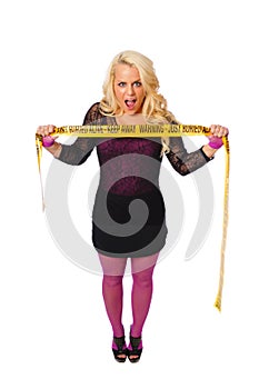 blonde woman with warning tape