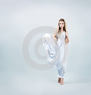 Blonde Woman in Waving White Dress photo
