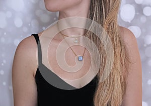 Blonde woman wearing gold necklaces