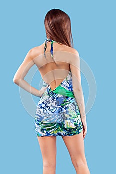 blonde woman wearing pink swimwear posing on color background. Perfect body. Bikini catalogue.