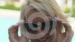 blonde woman wearing sunglasses