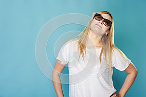 Blonde woman wearing sunglasses and summer clothing