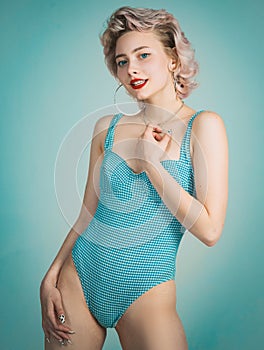 Blonde woman wearing swimsuit in pinup pose. Beautiful Woman in swimsuit, retro blonde girl, beauty fashion woman