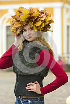 Blonde in wreath of maple leaves