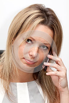 Blonde young woman with mobile phone