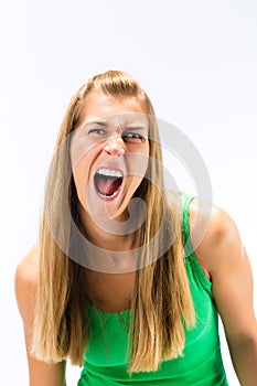 Blonde young woman screaming