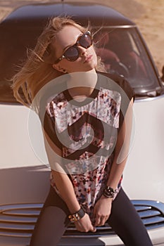 Blondie young girl at the wheel of sport car