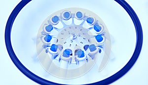Blood in centrifuge. Platelet-Rich plasma preparation. Tubes with blood in Centrifuge. Blue tonned image