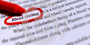 blood clotting text highlighted with red colour line border on white paper sheet photo