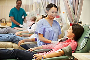 Blood Donors Making Donation In Hospital