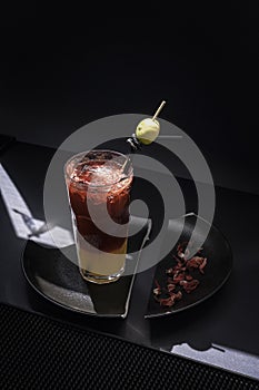 BLOOD ORANGE BOULEVARDIER COCKTAIL with dark background