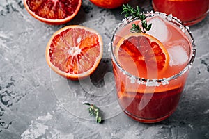 Blood Orange Margarita cocktail with ice and thyme