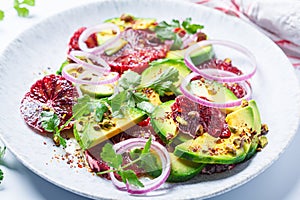 Blood oranges salad with avocado, pistachios and red onions