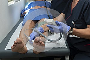 Blood pressure measurement from the popliteal artery leg, Ankle Brachial Index, Cardio?ankle vascular index, tibial pulse photo