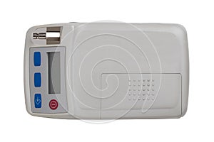 Blood pressure monitor. Close-up of an outpatient 24 hours blood pressure monitor system isolated on a white background. Macro