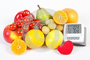 Blood pressure monitor and fruits with vegetables, healthy lifestyle