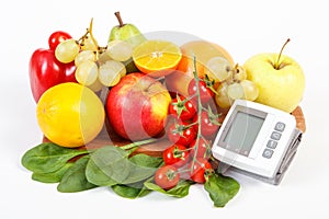 Blood pressure monitor and fruits with vegetables, healthy lifestyle