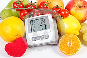 Blood pressure monitor and fruits with vegetables, healthy lifestyle