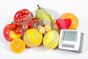 Blood pressure monitor and fruits with vegetables on white background, healthy lifestyle