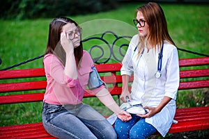 Blood pressure test. caring doctor or nurse taking young patient