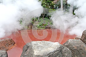 Blood red hot spring in Beppu