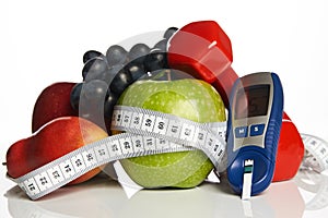 Blood sugar control with healthy organic food and dumbbells with