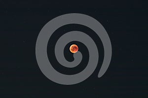 Bloodmoon or red moon phenomenon with dark sky