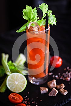 Bloody marry cocktail with fresh tomatoes juice, celery & spices