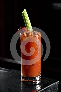 Bloody Mary on a bar desk. black background.