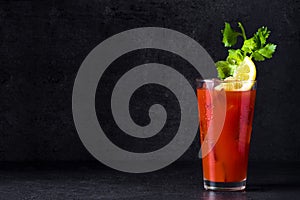 Bloody Mary cocktail on black background. photo