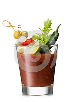 Bloody mary cocktail mix with red and green pepper and olive, celery,olives and lime slice on white background