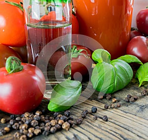 Bloody mary drink ingredients on a rustic wooden table