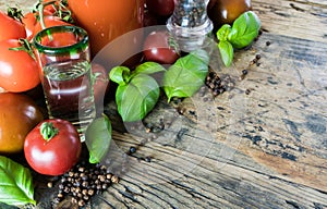 Bloody mary drink ingredients on a rustic wooden table