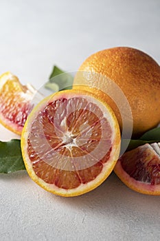 Bloody orange fruits composition. Abstract citrus fruit on bright background.