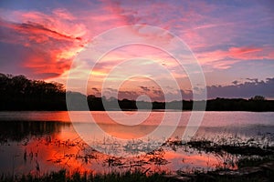 Dramatic sunset over the lake nature background.