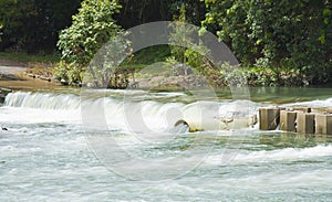 Bloomfield river in flood flowing over the bridge