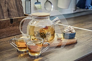 Blooming flowering tea in glass teapot