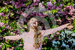 Blossom smell, allergy. small girl child in spring flower bloom. summer. Childhood beauty. Living in the moment. Natural