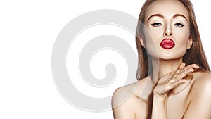 Blow sweet kiss. Beautiful woman with fashion lips make-up on white background. Valentines day Makeup. Sexy look