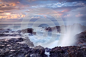 Blowhole on rocky coastline