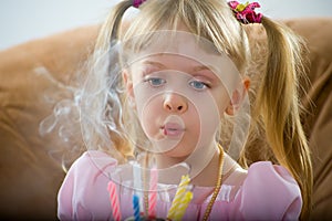 Blowing on a birthday candle