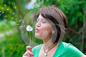 Blowing a dandelion