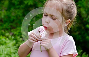 blowing dandelion fluff