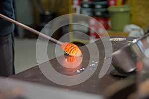 Blowing glass bowl in glasswork in czechia