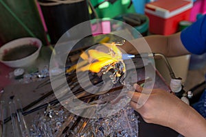 Blowing glass in a elephant shape. Handcrafting