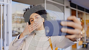 Blowing, kiss and selfie of woman in city with profile picture, photography and social media. Happy, gesture and person